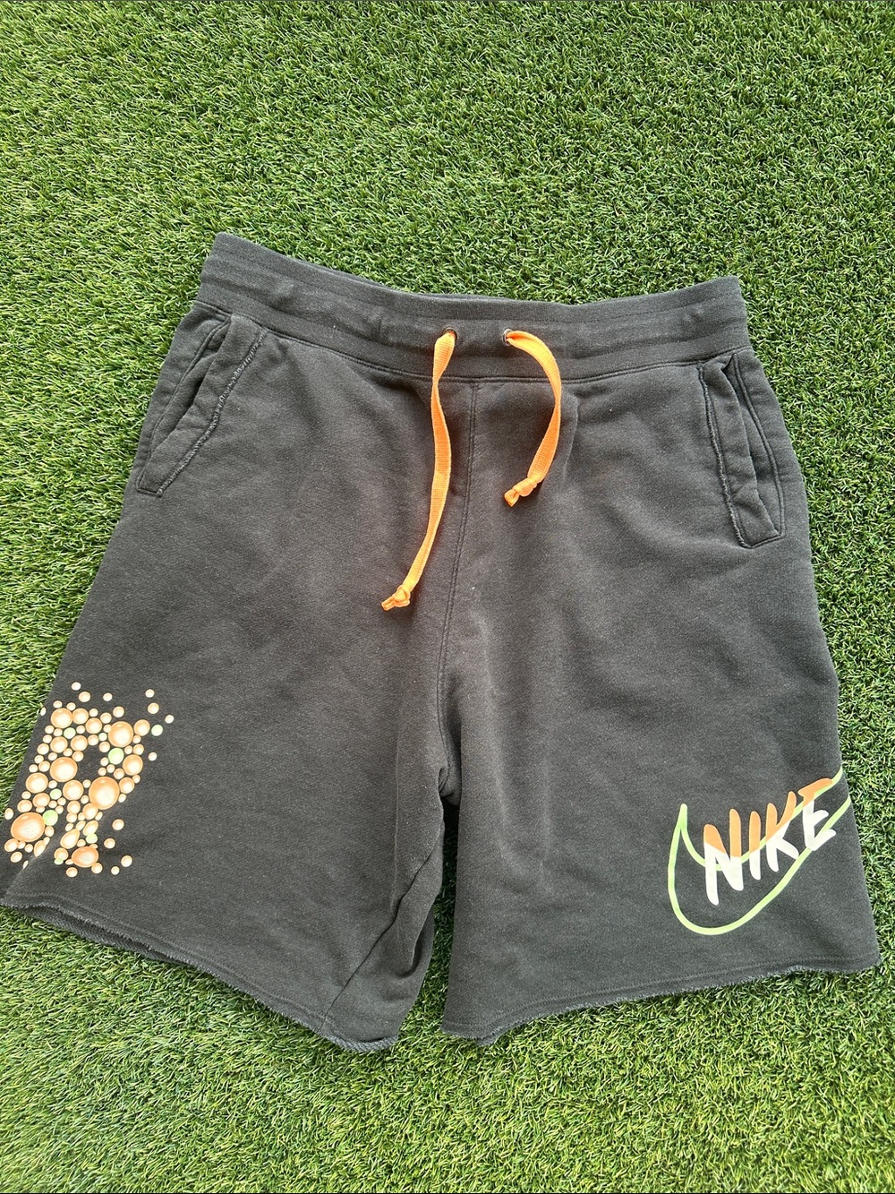 Nike Black Shorts with Orange Drawstring and Neon Logo